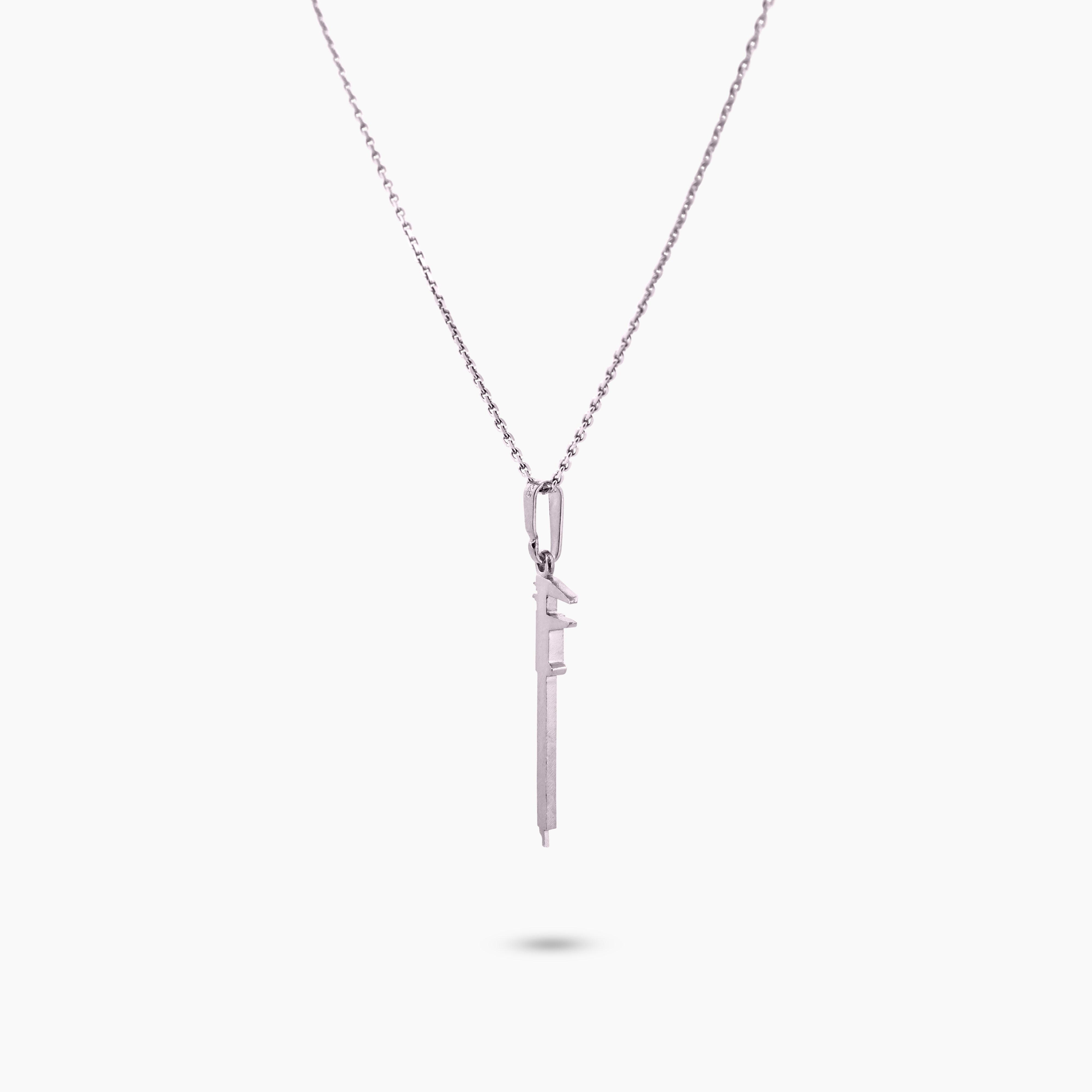 Pinchme bedel close-up van schuifmaat bedel met zichtbare meetstrepen