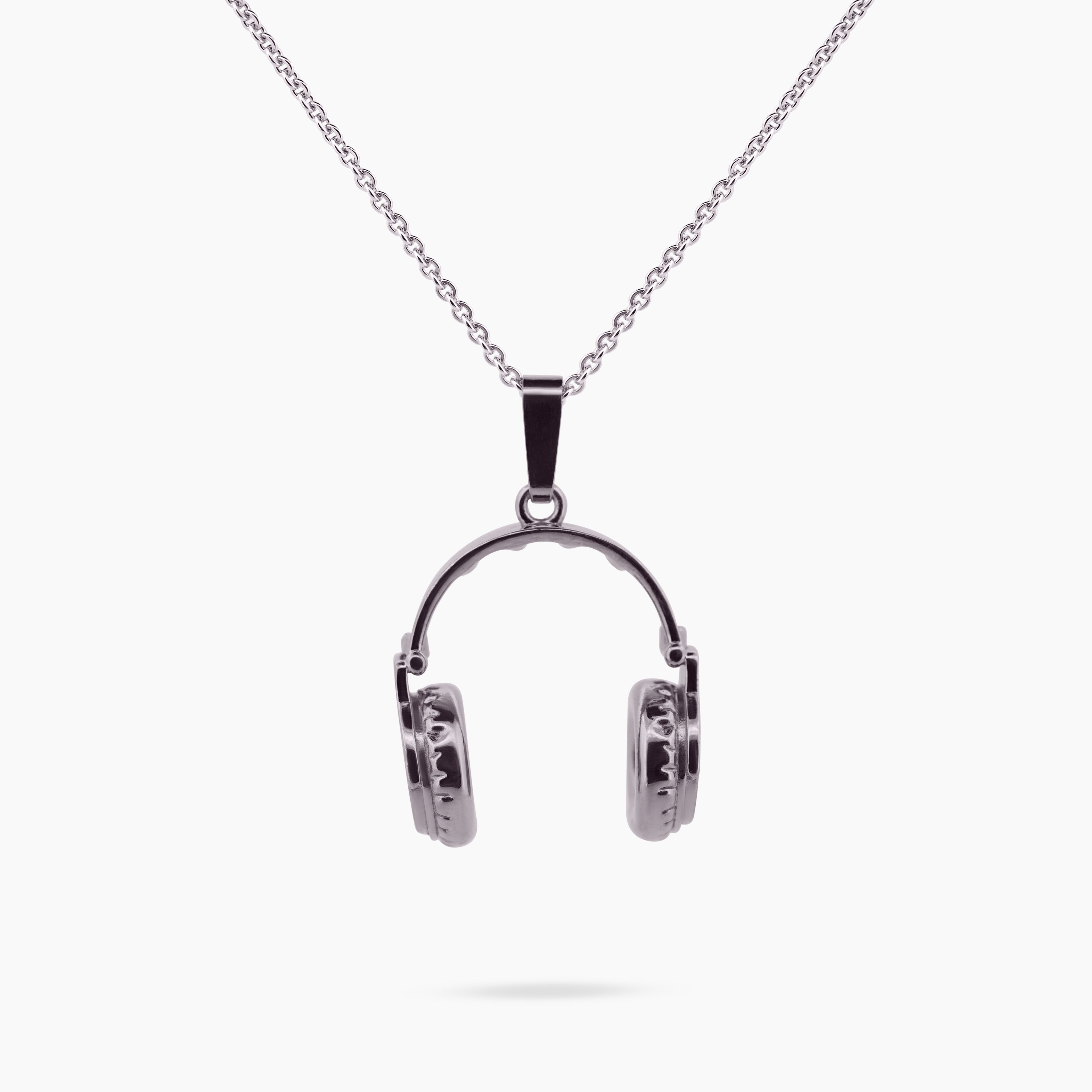 Close-up van kleine koptelefoon bedel met gebogen hoofdband en oorschelpen